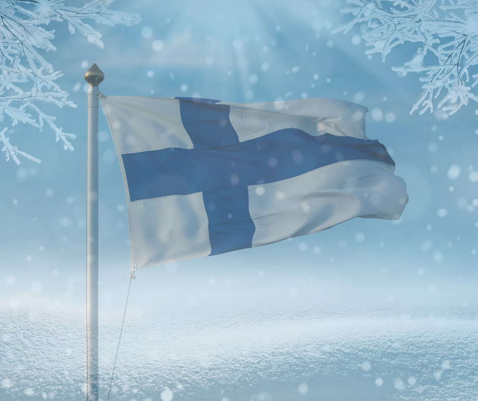 Luminen maisema ja liehuva Suomen lippu